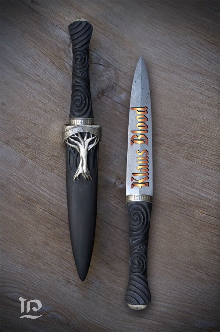 Klaus chuckles at <a href="/kittyKatPierce1/">⚰️ Kitty Kat pierce⚰️</a> &amp; @BellsVamp “do you mean this dagger I have found that bells had” he pulls a face knowing that he had the two of them up against the wall and they couldn’t do anything about it. “So kitty I can just torture you now” he laughs at his own words.