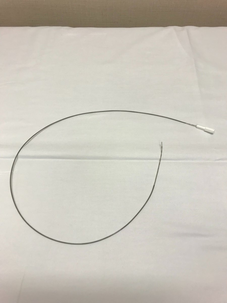 Next, you thread a lead through the introducer needle into the epidural space (picture 1). The lead has, in this case, eight electrodes at its tip (picture 2). The opposite end has contact points for these electrodes (picture 3).