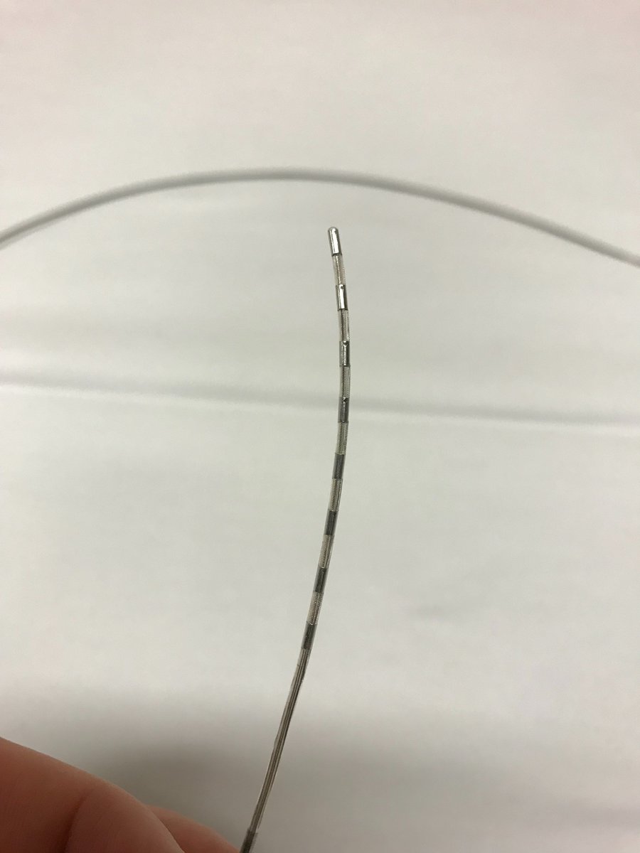 Next, you thread a lead through the introducer needle into the epidural space (picture 1). The lead has, in this case, eight electrodes at its tip (picture 2). The opposite end has contact points for these electrodes (picture 3).