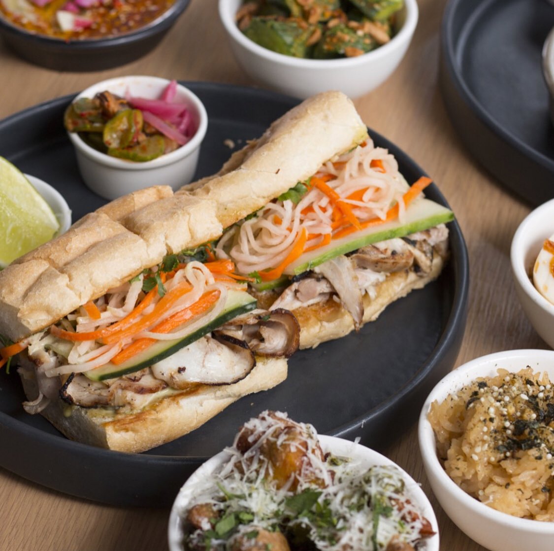 CityCenterDC's tweet photo. Momofuku unveils their new lunch menu! Have you had the chance to try it out yet? Here’s some of the line up - the five spice porchetta po’ boy, Creekstone Farms prime beef dip, and edamame falafel. #Momofuku #MomofukuCCDC #DCLunch #NewMenu #CCDC #ChefTae #DCEats #CityCenterDC https://t.co/AYP2WCMbNe