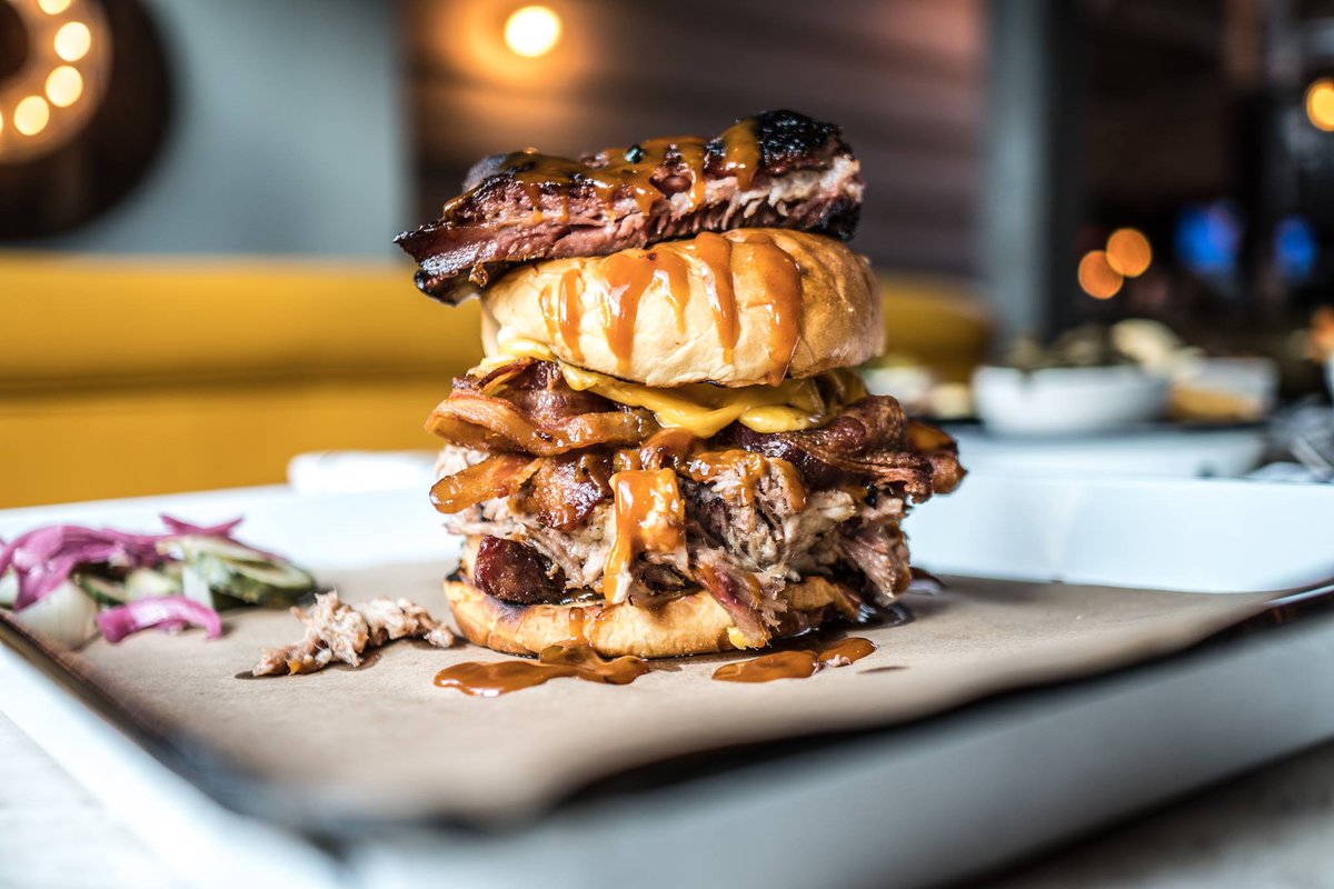 PoogansSmkHouse's tweet photo. Can you handle The Four Porksmen?Pulled pork, pork belly, smoked bacon, American cheese, house BBQ sauce, all piled high and topped with a St. Louis rib!

#pooganssmokehouse #barbecue #thefourporksmen #charleston #bbq #foodie #CHSfoodie #CHSeats #eatlocal #yum #explorecharleston https://t.co/6mhq0HZsF6