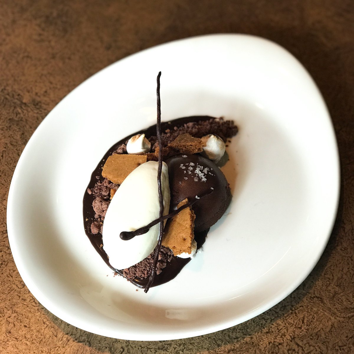 #NationalSmoresDay today! Come try our grown-up version of this summer classic - s’mores chocolate #cheesecake, smoked ice cream, graham cracker, maple marshmallow!
