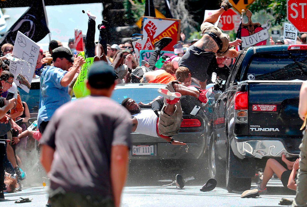Photo of Marcus Martin getting run over by a car in downtown Charlottesville.