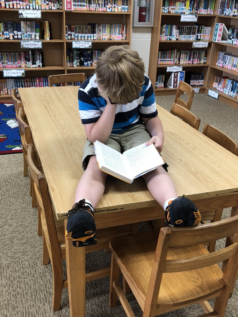 MrsHowardReads's tweet photo. When you tell your kids to find a comfy spot in the library this is not what comes to mind but hey, to each his own as long as they are reading and loving the library! 📚📚📚#ceslibrary https://t.co/mFykAfQRAF