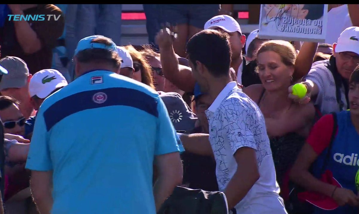 DjokovicUk's tweet photo. Team Djokerson lost their QF match tonight, but that didn’t stop the fans going wild for Nole’s autograph! One guy was making such a noise and was so happy when Nole signed his big photo, he was showing it off to everyone 😆 #NoleFam #FansGoWild https://t.co/upSUG327Qp
