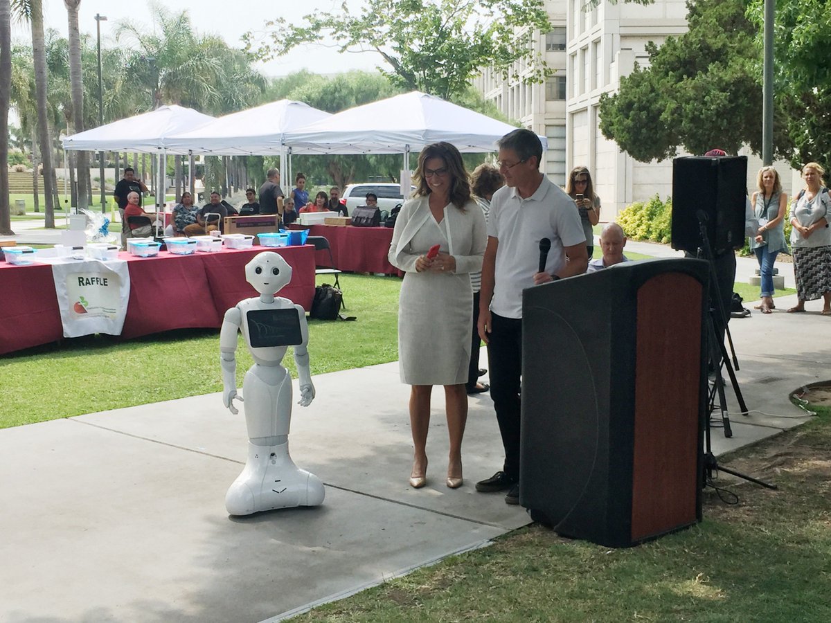 LoyolaMarymount's tweet photo. Today, as part of "Innovation Friday," President @LMUSnyder and LMU First Lady @CarolHLN stopped by the #C3TechConf for a chat with Pepper, the humanoid robot! https://t.co/GF7M3NzMoM