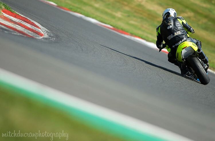 Q. Can a paraplegic lean a bike? A. Enough to leave a line of toe slider behind (zoom in to see). Mitch takes great photos. Talan needs to tidy his line!