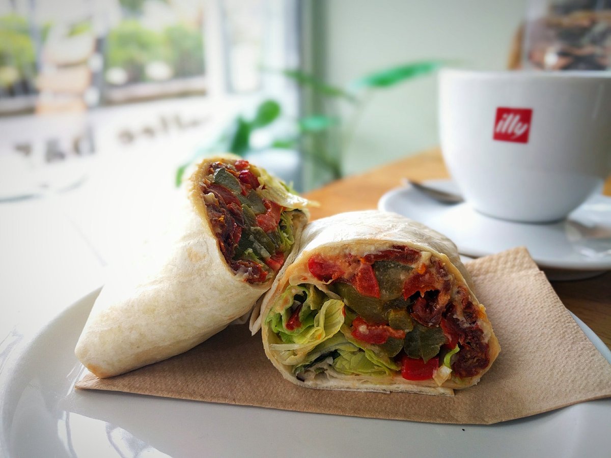 MattandCat's tweet photo. Late lunch in @FrenchFranks. Tasty Moroccan wrap: roasted peppers and hummus with extra sun-dried tomatoes. #PlantBasedDining #Vegan https://t.co/Cc4RhSSdKa