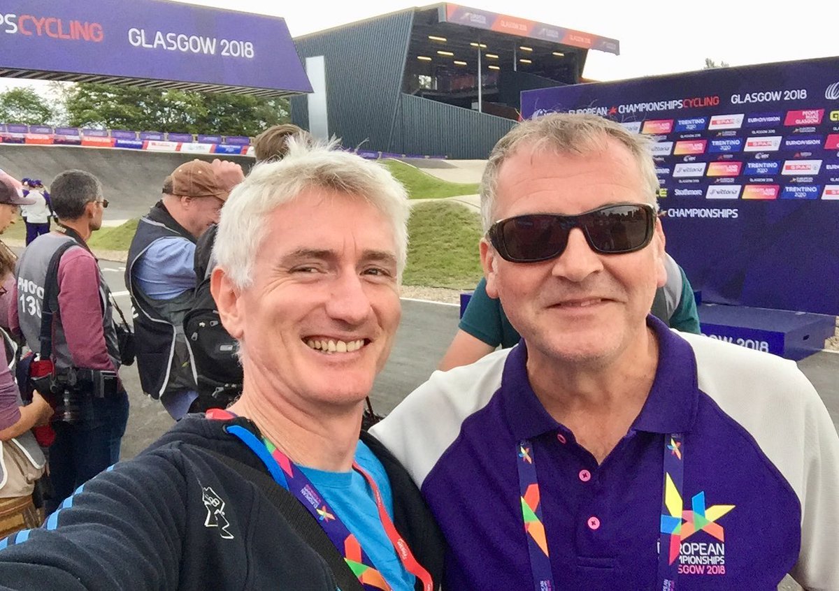 PearceIntSport's tweet photo. A rare shot of the big man, Cavan Pawson, as the photographers get set up for the medal ceremony, women’s mountain bike ⁦@Glasgow2018⁩. Great weather, great sport, great #pressoperations team #TheMoment https://t.co/X9qpIfdIBZ