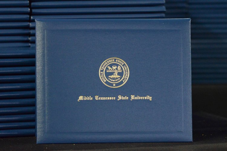 Degree from Middle Tennessee State University shown amid stacks of similar degrees from the university's summer 2018 commencement ceremony Aug. 11.