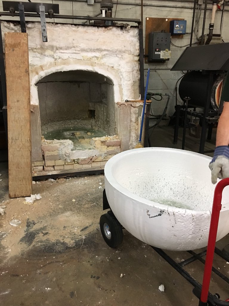 The glass furnace rebuild continues! Today it was out with the old crucible (the giant bowl that holds the 2,000 degree clear glass). #glassblowing #hyattsville #acreativedc