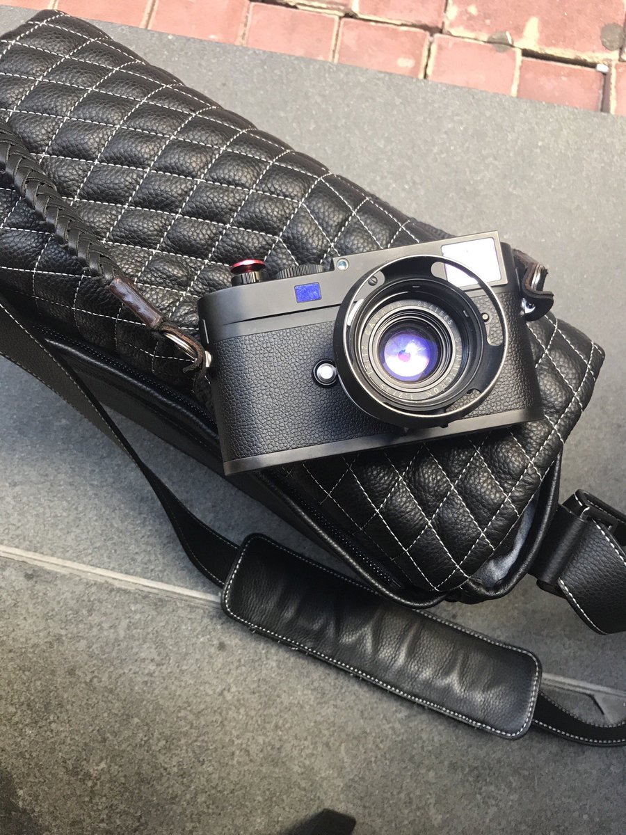 Barton_1972's tweet photo. What’s on my bag ??? A camera, a lens, a soft release and a strap ! https://t.co/RidwPxpiEp