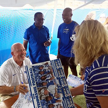 tstinnett3's tweet photo. As I saw all of the smiles on the faces of thousands at #FanDay for the #BlueRaiders today it reminded me how proud I am, as an alum, to have a man such as @CoachStock  leading @MT_FB ! I am even more privileged to witness his work on a daily basis #Blessed4Sure https://t.co/MVABpVOXre