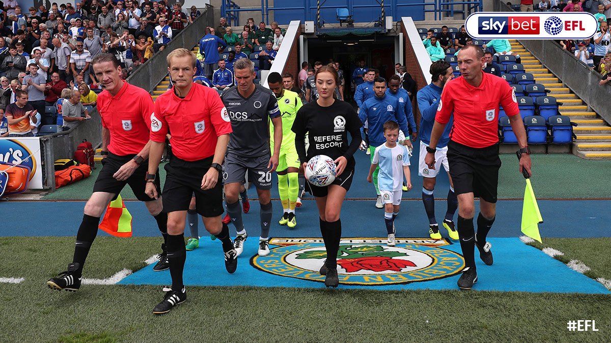 EFL's tweet photo. Handing over of teamsheet 🤝
Testing technology 📹
Pre-match warm-up 🏃‍♀️

@Rovers offer young fan an opportunity to be a match official's mascot for the day >> https://t.co/R13E7zWOZj https://t.co/IjBd0VLONR