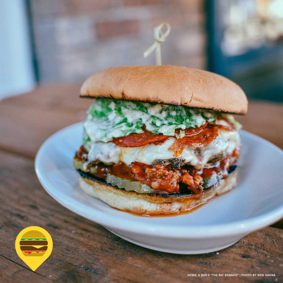 #Portlandburgerweek  The Fat Brando - It's like a meatball sub, except it's a burger and it's even more delicious. A beef patty with Italian sausage, marinara and provolone, topped with Caesar salad on a garlic-buttered sourdough roll.