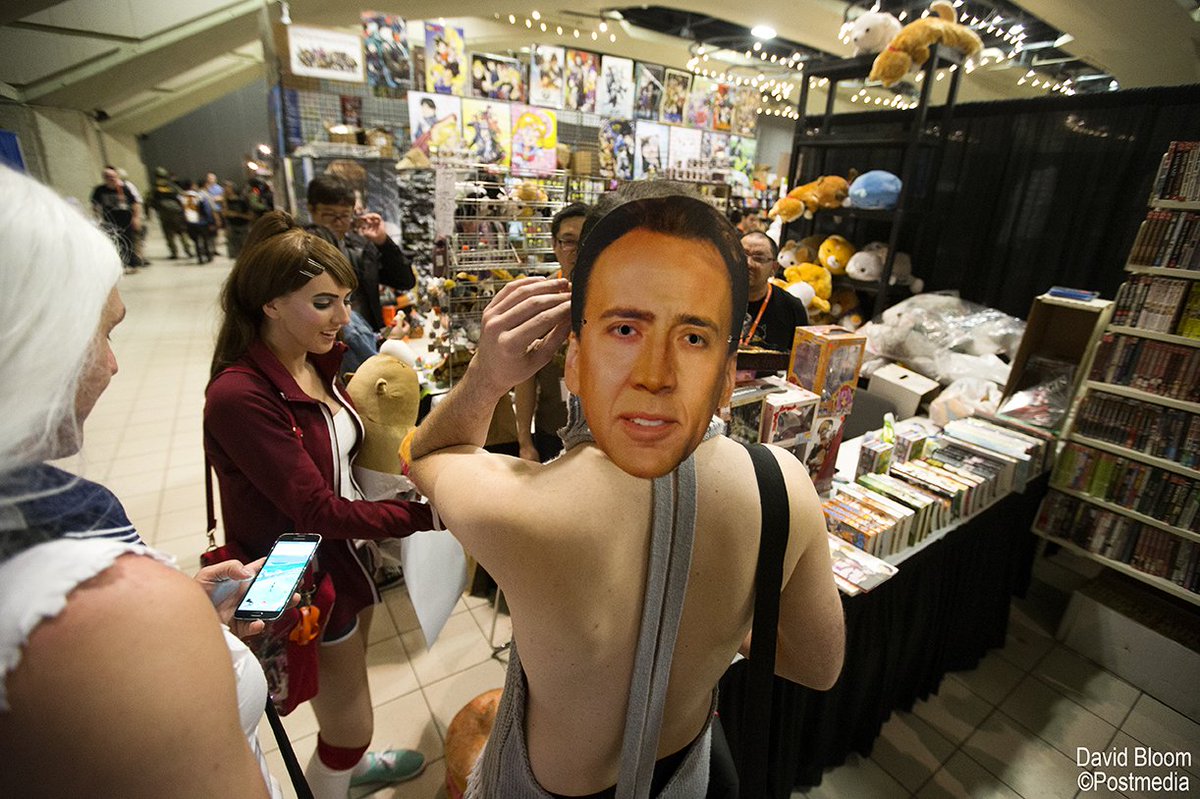 davidbloomphoto's tweet photo. Finding weird little moments is my favourite part of photography. Donald Evans wears a custom Nicolas Cage cosplay costume during Edmonton's Animethon 25. #yeg #animethon25 https://t.co/zPH8cuGZS8