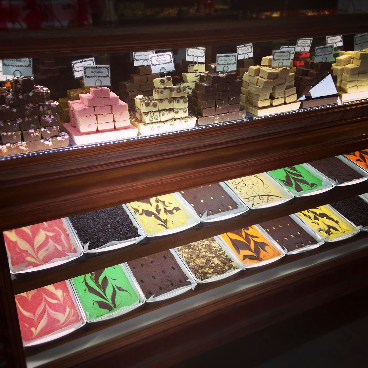 Fudgencoffee's tweet photo. Today's beautiful Fudge counter photo. Selection includes: Silky Musk, Gingerbread, Vanilla Milkshake, Caramel Latte, Native Bush Pepper, Turkish Delight........and many many more, including the local favourites (eg. Lemon Meringue!!).  See you soon for a free taste! #fudge #tas https://t.co/TCJhV7Lnoa