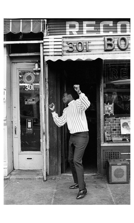 A record store patron enjoying the music, Harlem, NYC c.1967 by Art Kane
