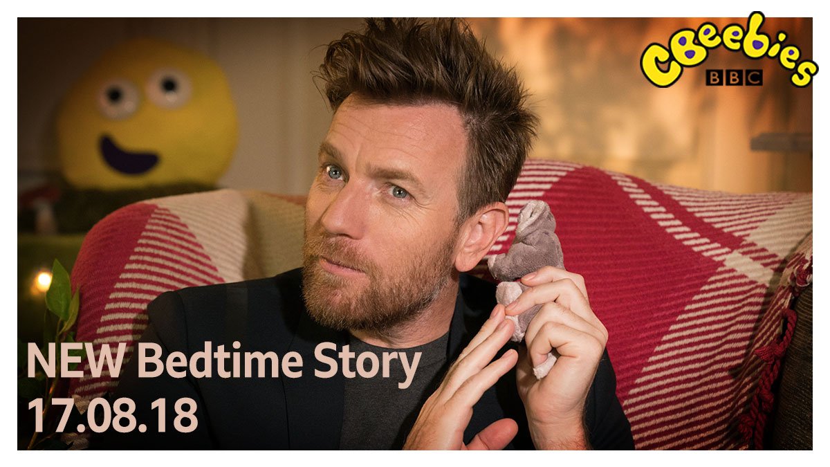 Actor Ewan McGregor with cuddly toy mouse whispering in this ear