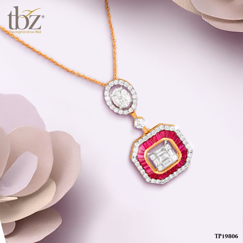 Stop and stare at this beautiful, closely set diamond and ruby pendant.
