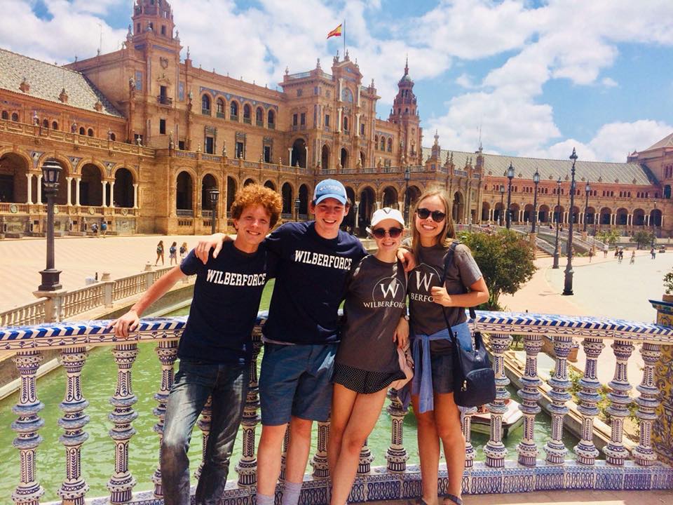 WilberforceNJ's tweet photo. Collin Frisch and Clara Whitman, both rising seniors, in Sevilla, Spain, doing missions work with refugees this summer.  They got two of their friends to sport #wilberwear with them as well! #wheresyourwilberwear https://t.co/G3TbcBxpOd