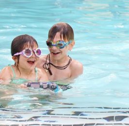 Have fun with <a href="/Bling2oUK/">Bling2o UK</a> Look at this great photo by <a href="/strollerincity/">Brianne Manz</a> #swimminggoggles #bling2o #havefun #donuts #prehistoric #funinthepool #children #summer #holidays #siblings #familytime #POOL #water