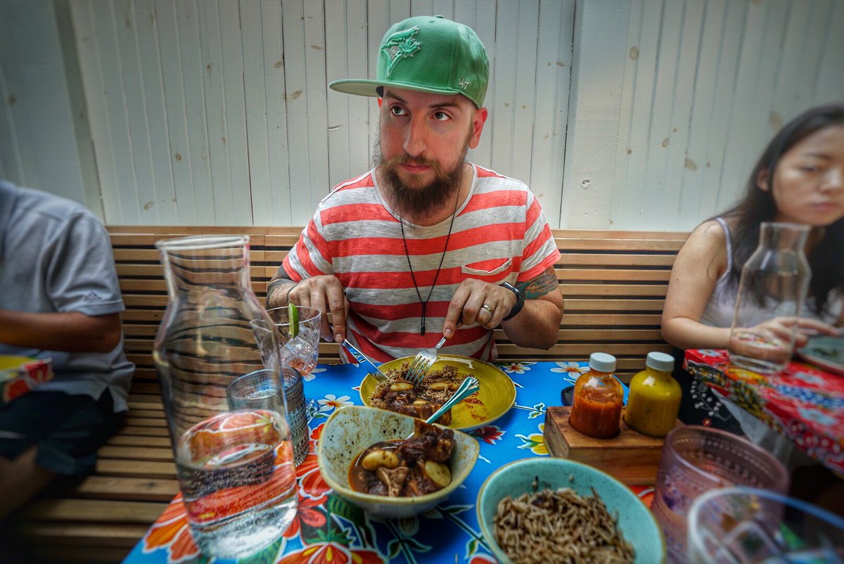 Simon eating Jamaican food