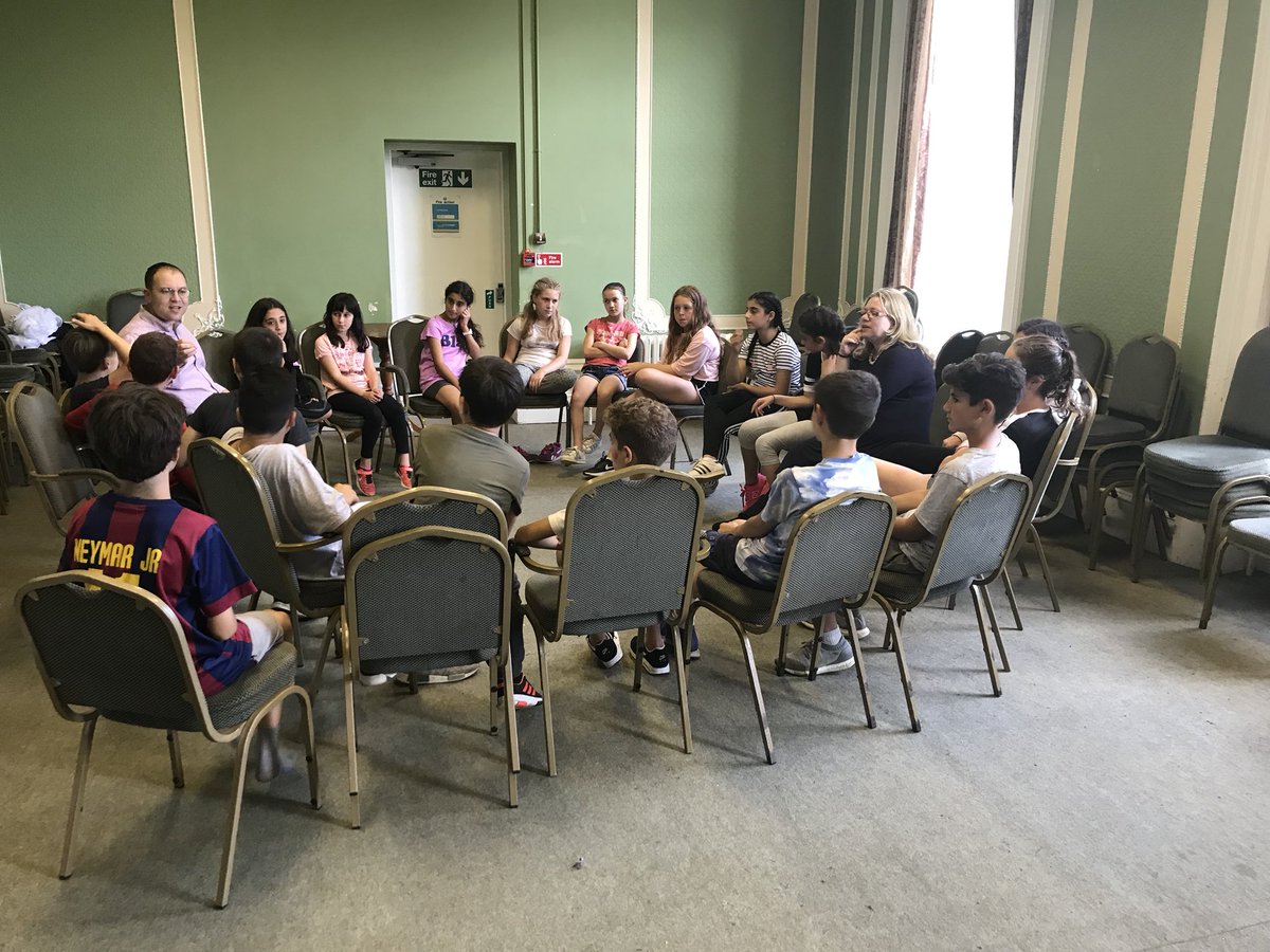 TheTribeUK's tweet photo. Our @UnitedSynagogue trustees @FleuriseLewis and Saul Taylor engaging with participants on #CampZev #TribeSummer2018 https://t.co/D0x9LnND5V