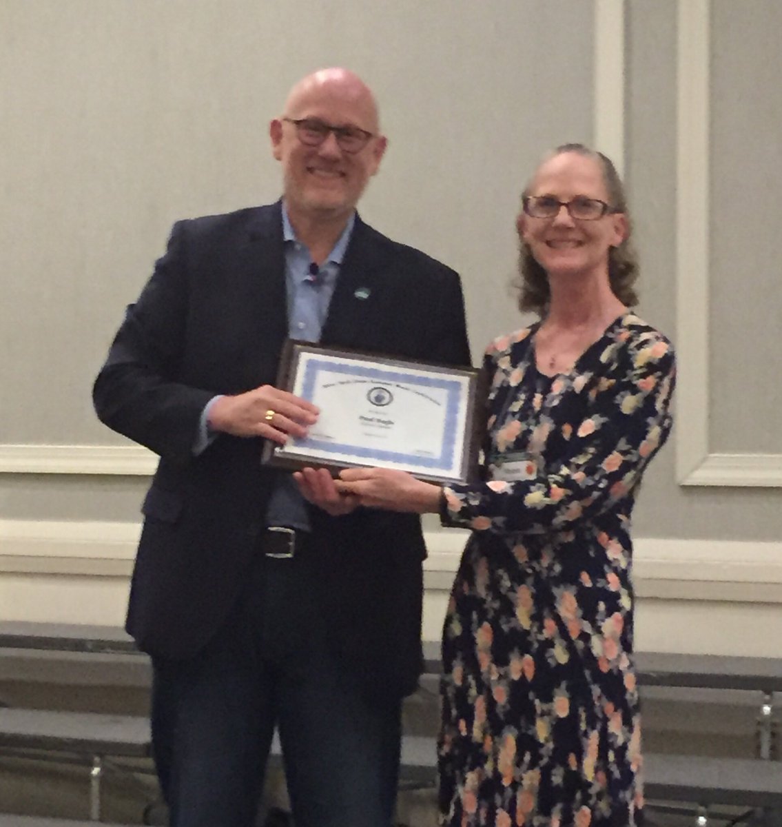 NYSSMA_Official's tweet photo. @cim_edu president Paul Hogle is presented with a plaque by @NYSSMA3rdVP Robin DeSantis showing our appreciation for delivering the Keynote Addresses at #NYSSMC18 https://t.co/GUm7RvU6ga