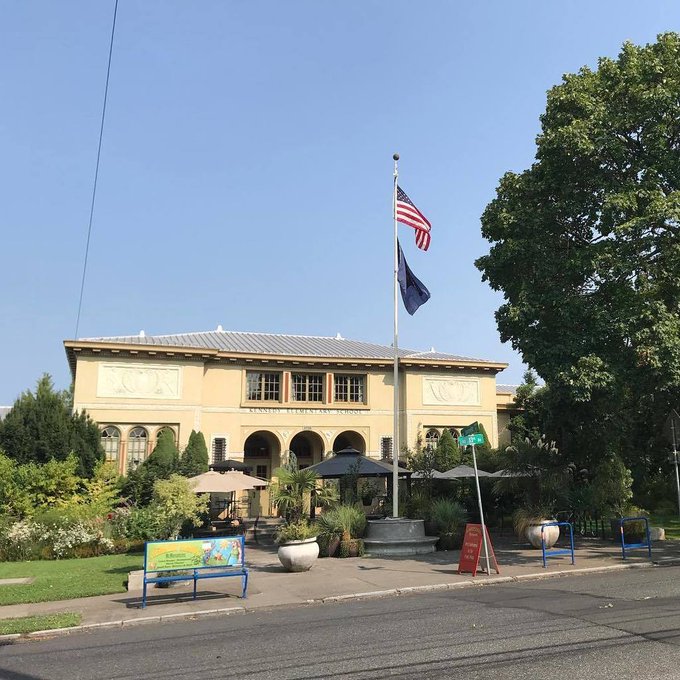 McMenamins Kennedy School flying a US and Oregon State Flag. This school, near downtown Portland, was converted to a hotel. You get the sense you’re at Hogwarts inside except you can enjoy a pint or watch a movie in the old auditorium. https://t.co/uNdPRob2Lf https://t.co/FifkpUC8hR