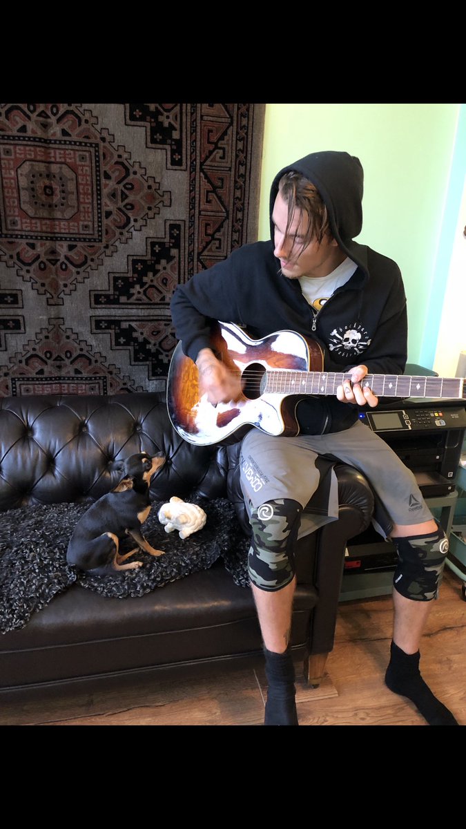 NymanAlbin's tweet photo. A Boy and His Dog. #Dog #DogsOfTwitter #Guitar #Music https://t.co/4U7YzMvMLE