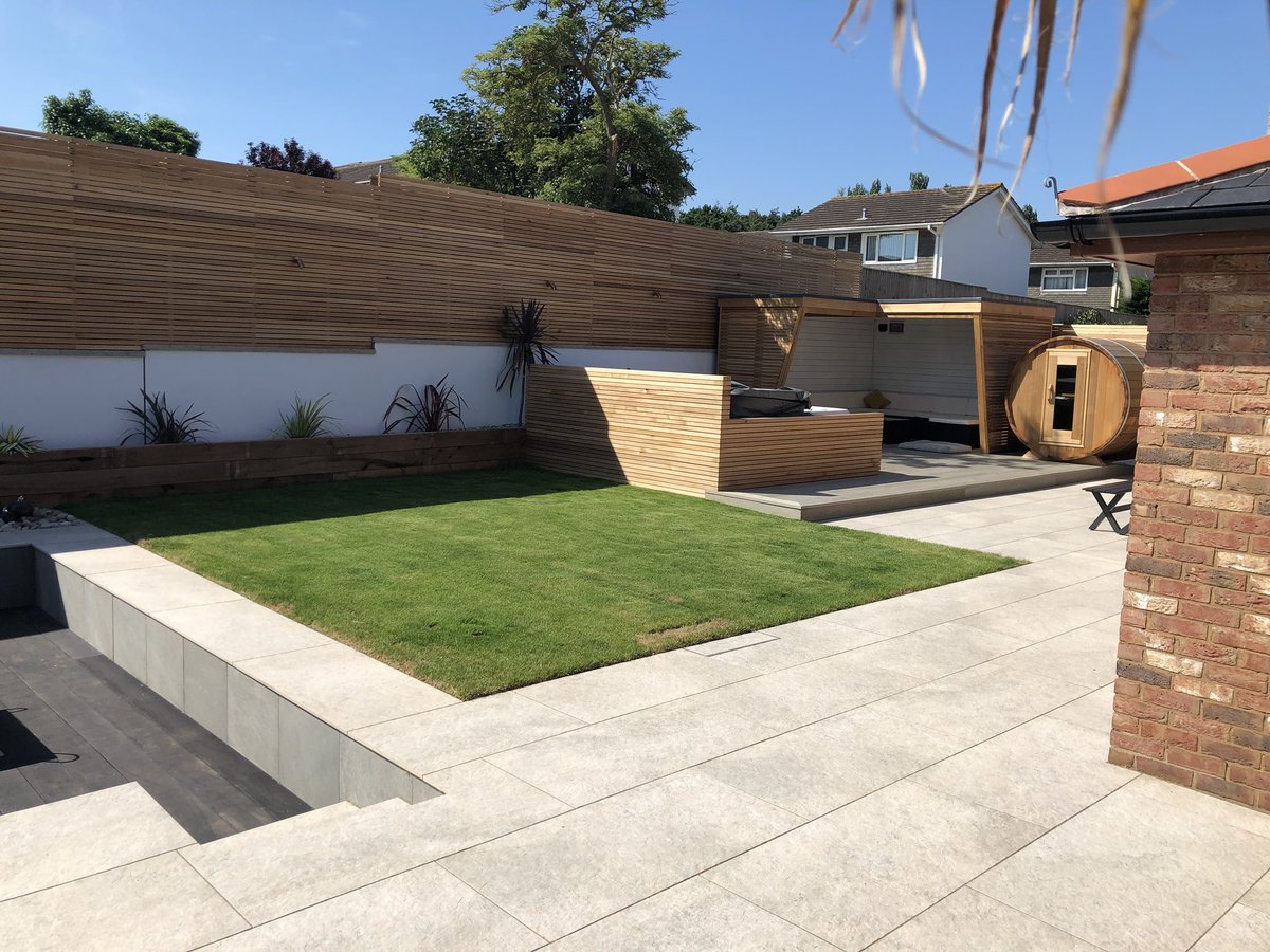 UrbanEarthSW's tweet photo. Jack Nowell came to us wanting a low maintenance, modern &amp; child friendly outdoor space. We created a stunning clean lined, contemporary shaped garden featuring; sunken fire-pit, Jacuzzi, sauna, a bespoke summer house &amp; cedar fences. Ideal for all year round enjoyment&amp;family fun https://t.co/1JBqeBluYz