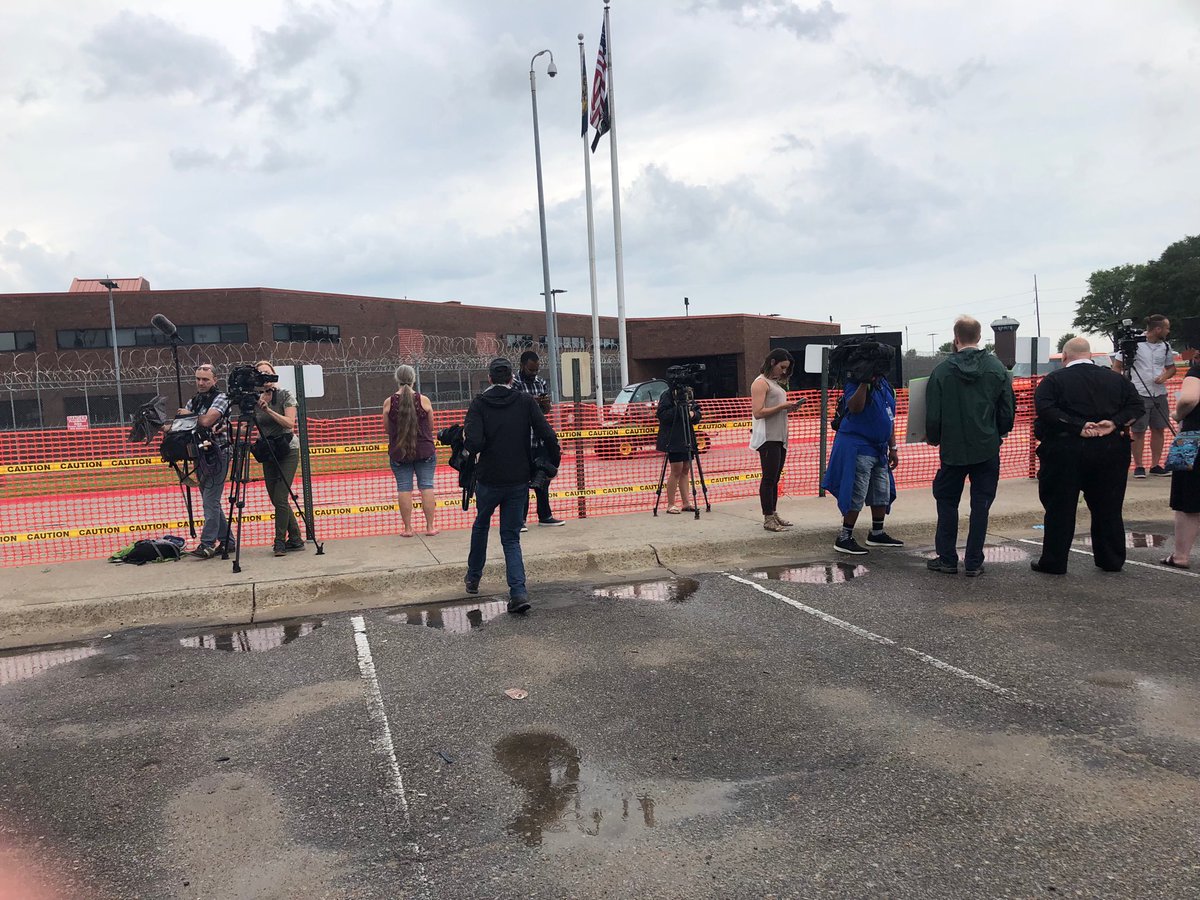 LJSreist's tweet photo. Death penalty opponents moving close to the front of the opponent area barricade nearest to prison. Rain starting to fall. https://t.co/ZNajZAP6wd