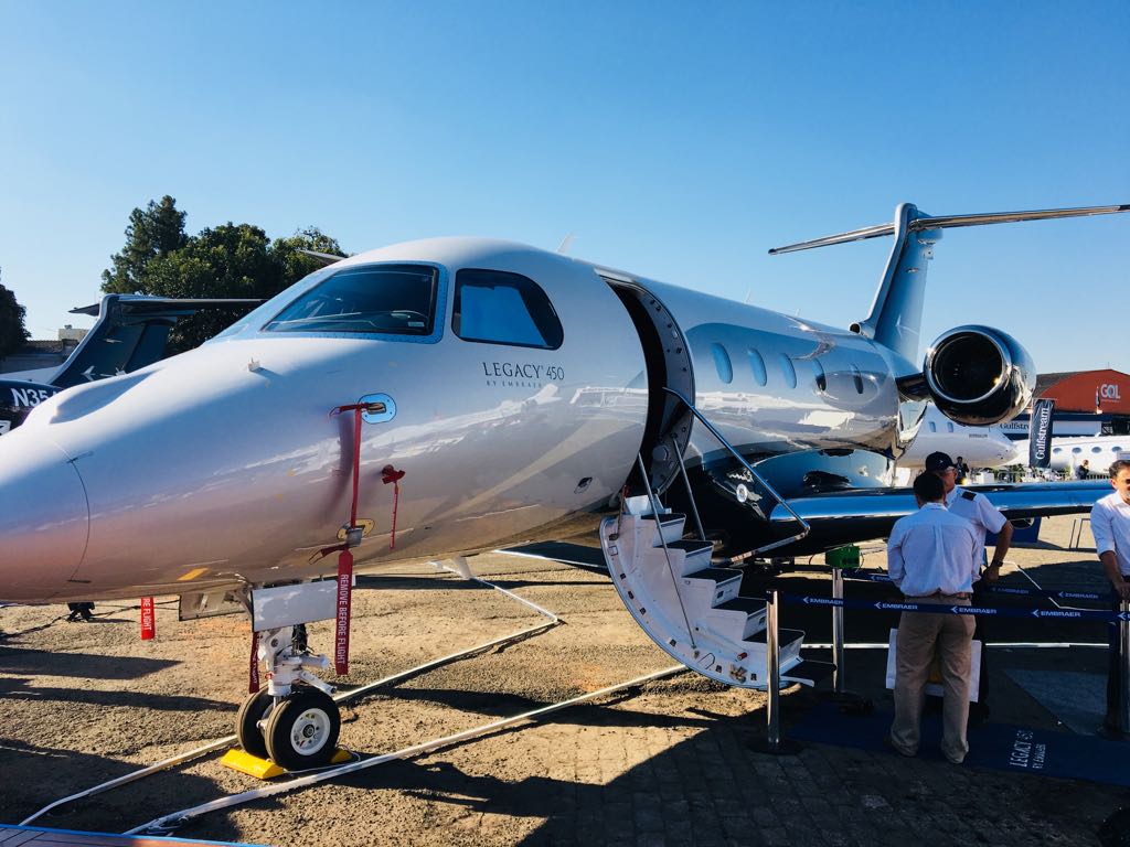 embraer's tweet image. The #Embraer #Legacy450 is the only jet in its class to replace conventional controls with full Fly-By-Wire technology. Even better? It’s at #LABACE! #EmbraerStories