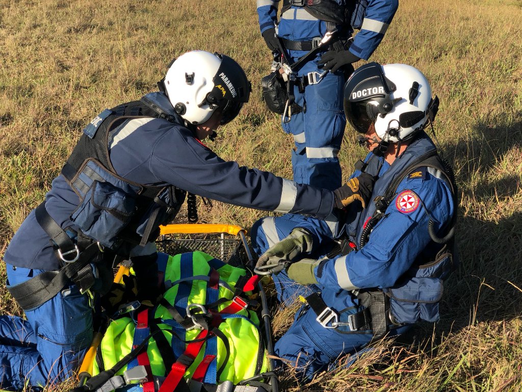 tollambulance's tweet photo. A recent winch currency training session for our @NSWAmbulance doctor and paramedic shows them completing a safety pre-winch SPECTER check - Stretcher, Patient, Equipment, Connectors, Tagline, Environment hazards and Radio call - prior to being winched into the aircraft. https://t.co/uA9SiMKrZg