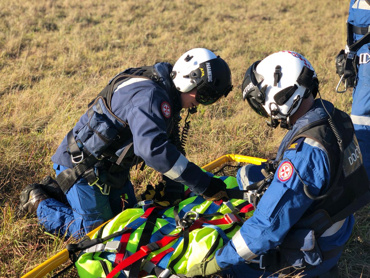 tollambulance's tweet photo. A recent winch currency training session for our @NSWAmbulance doctor and paramedic shows them completing a safety pre-winch SPECTER check - Stretcher, Patient, Equipment, Connectors, Tagline, Environment hazards and Radio call - prior to being winched into the aircraft. https://t.co/uA9SiMKrZg