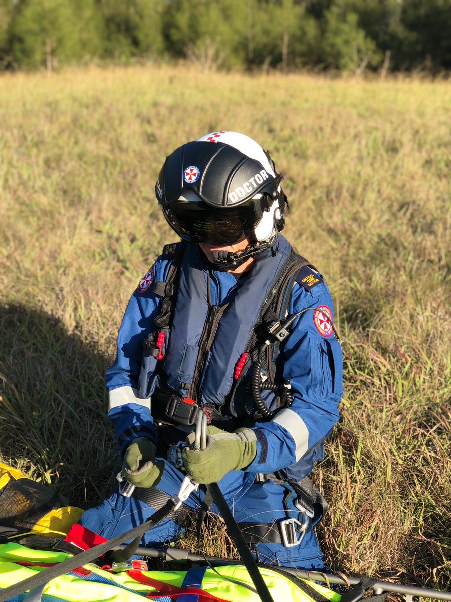 tollambulance's tweet photo. A recent winch currency training session for our @NSWAmbulance doctor and paramedic shows them completing a safety pre-winch SPECTER check - Stretcher, Patient, Equipment, Connectors, Tagline, Environment hazards and Radio call - prior to being winched into the aircraft. https://t.co/uA9SiMKrZg