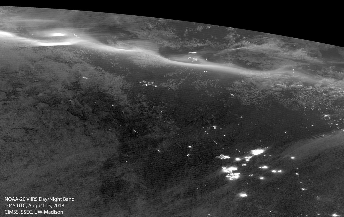 Check out the Aurora Borealis #NorthernLights captured here by our #NOAA20 satellite shining above the light of the #wildfires burning in #BritishColumbia Canada last night. More imagery:  goo.gl/G74rVB