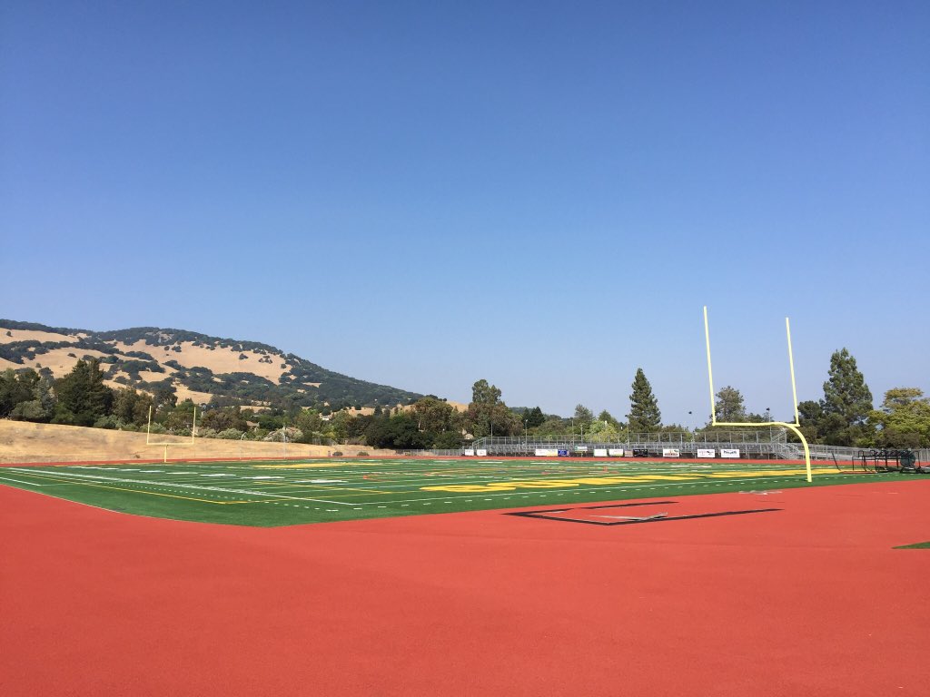 Amazing summer work at San Marin: new football field and track, and repainted gym floor!!  Wow!