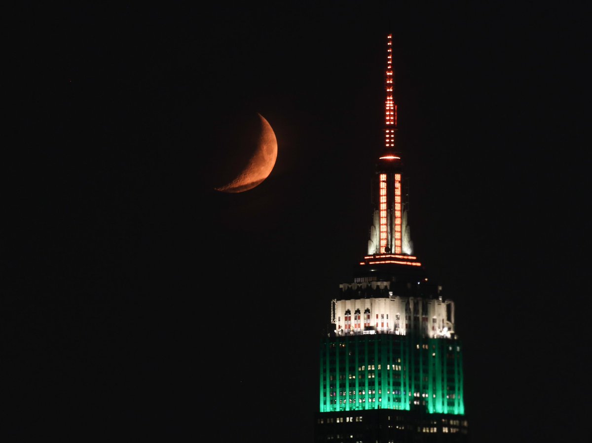 Tonight's crescent moon setting behind the Empire State Building from Crescent Street in Astoria Queens.