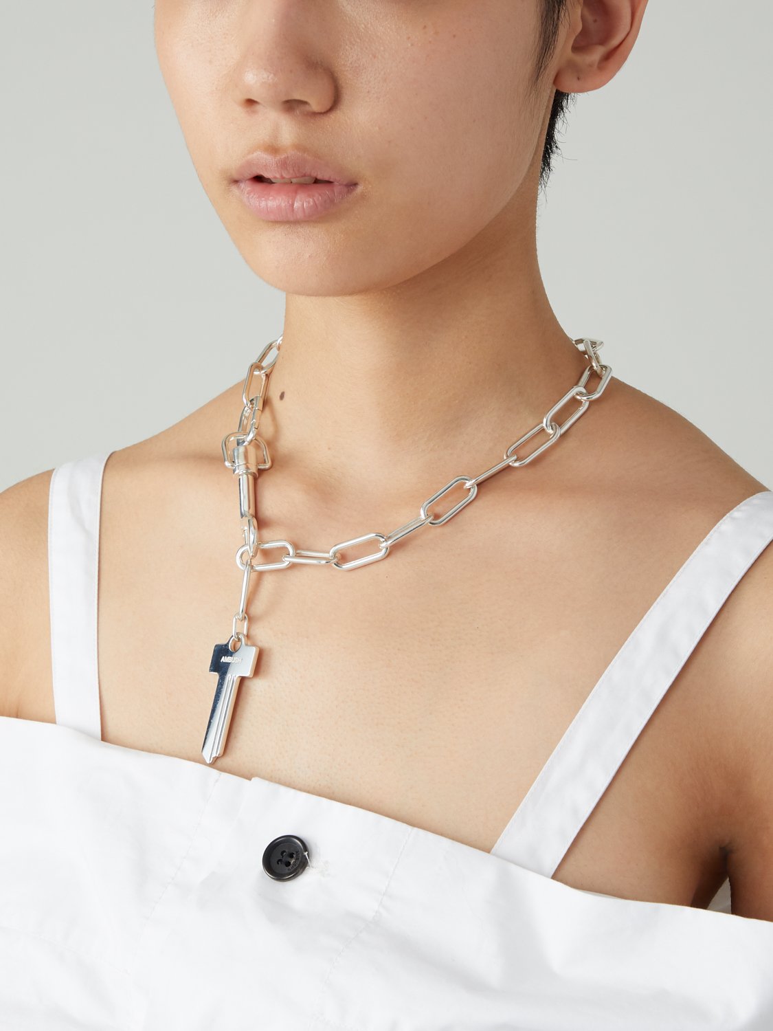 AMBUSH on X KEY motif is one of AMBUSH s signature. This fully sterling silver accent piece is ready to grace your body. Get our MIX CHAIN KEY NECKLACE here at NOBO AMBUSH
