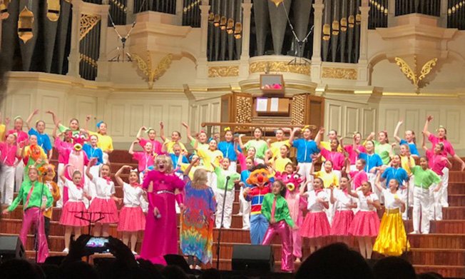 TangaraSchool's tweet photo. Tangara’s Primary Choir took to the stage on Tuesday night at the magnificent Sydney Town Hall. They performed The Muppets Medley, with fantastic singing, dancing and colourful costumes. Thank you to Mrs Harrison for developing the girls to such a high standard! https://t.co/n1aEINCSaJ