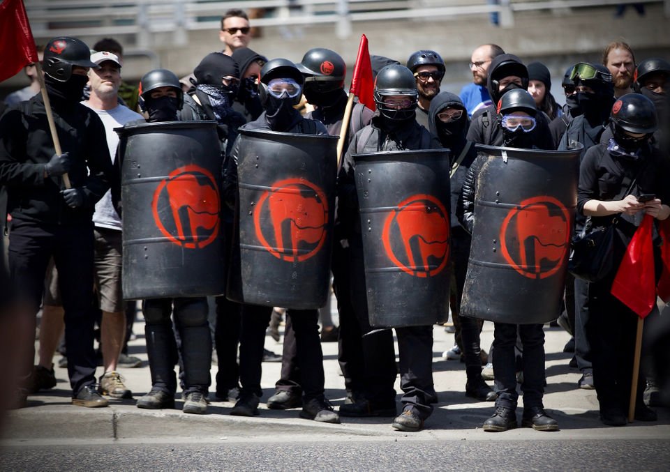 (6) Antifa with shields made from plastic drums. Most DIY shields can be confiscated as weapons. Sharp corners, heavy materials etc. Remind me what is the point of holding street demonstrations when we don't need to at this time?