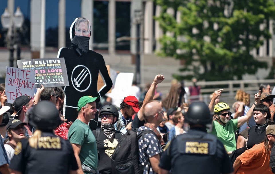 (14) The nonsensical signs always amuse me. "White supremacy is terrorism" it says. First, the only terrorism going on at this event was by the violent Left...