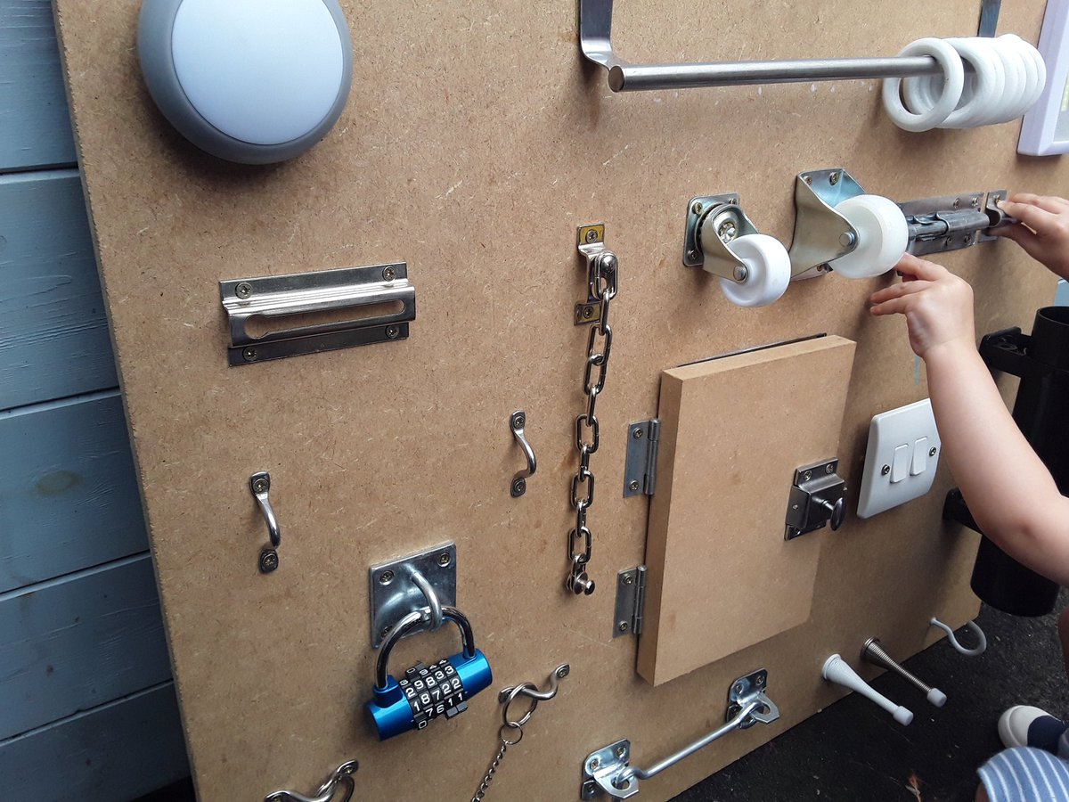springnortheath's tweet image. Baby Room are enjoying their new fidget board, they&apos;re enjoying figuring out the interesting locks and switches