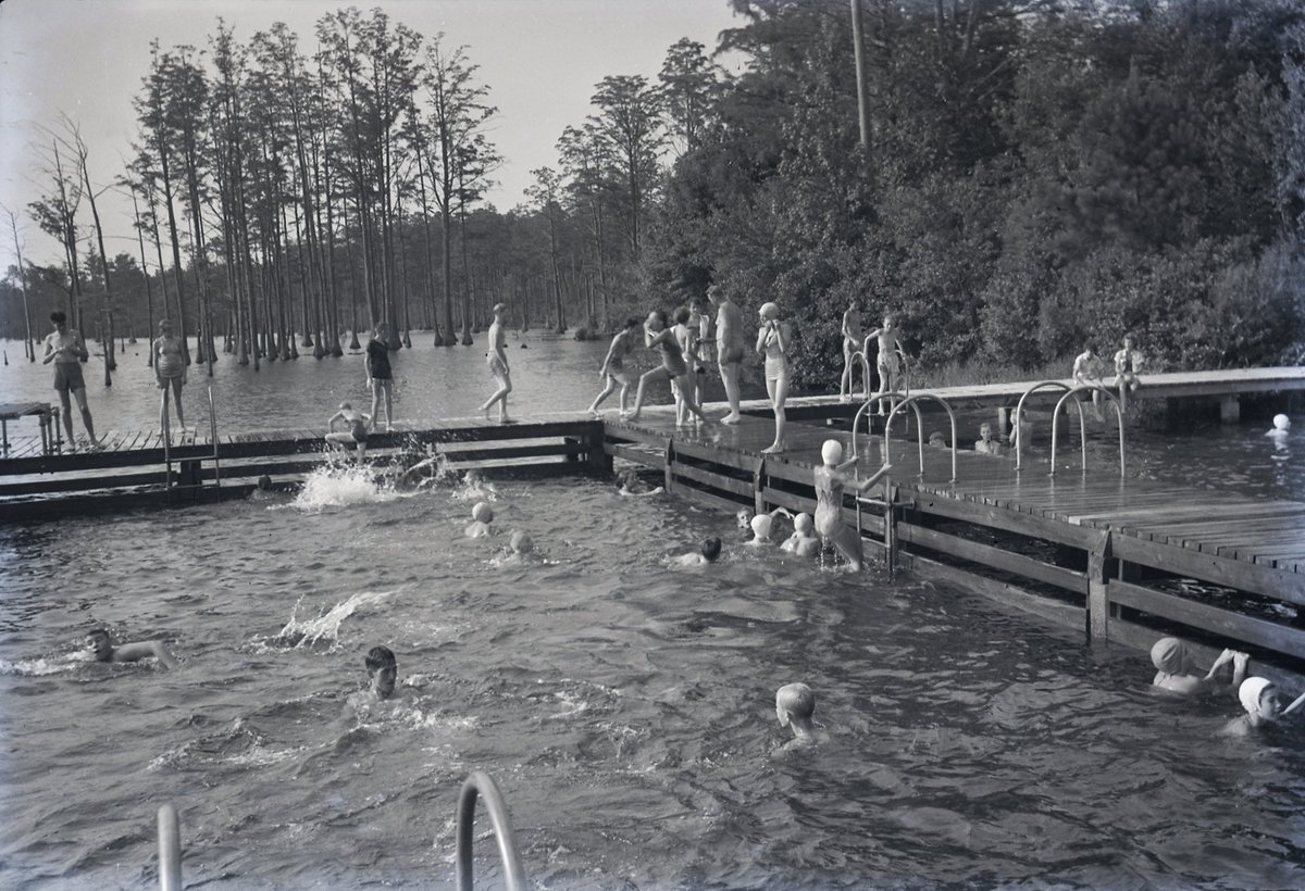 UofSC_SCPC's tweet photo. Summer is winding down. Last chance for #summerfun. Swimmers at a fishing pier, #Edisto, #SC, 1954 (William D Workman, Jr papers) #ThrowbackThursday #swimming #FamilyFunMonth #sctweets https://t.co/pl3ikQBHGL