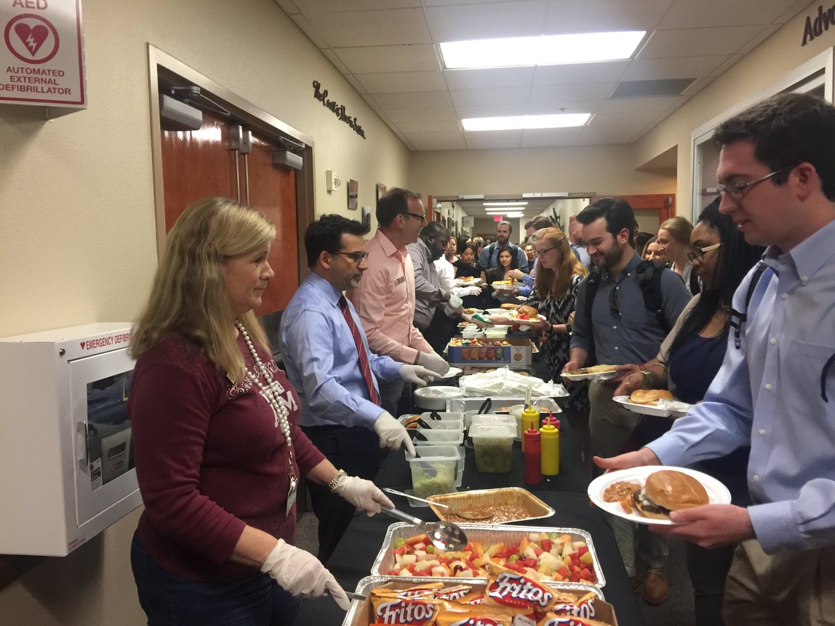 TAMULawSchool's tweet photo. New dean, Bobby Ahdieh, and law school faculty serve up some good eats at today's cookout for 185 first-year students. Yum! https://t.co/u5a1wyRCOY https://t.co/gsmWOlSDL3