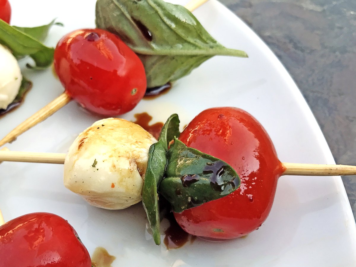 #Capreseskewers!!  One of our favourite ways to enjoy the bounty of our garden.  #Cherrytomatoes #basil #bocconcini drizzled with a beautiful #balsamicvinegar and #oliveoil from @TheItalianStar to finish this out!  

 #gardenfresh #culinaryslut  #caprese #summersnacks #yyz
