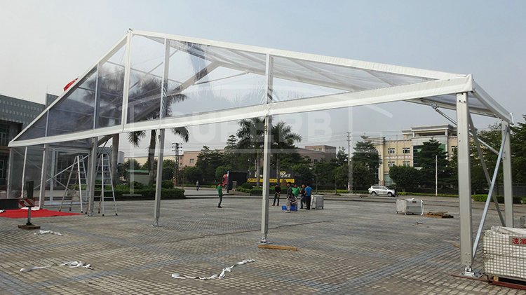 If you are looking for a big tent for party or business events, but worry about the lighting problem for the bigger the tent is, the less daylight can travel into. So what about replacing two bay of roof covers into the transparent fabric