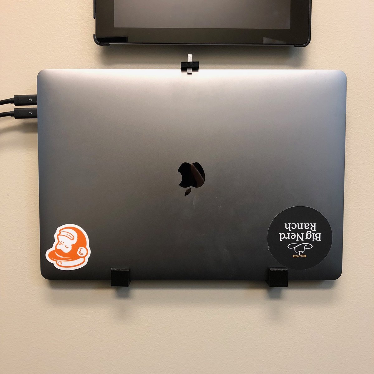 paulbrown's tweet image. I don’t have many stickers (and no Laravel ones at that), but I did 3D-print some brackets to hang the laptop on the wall!
#laravelstickercontest2018
